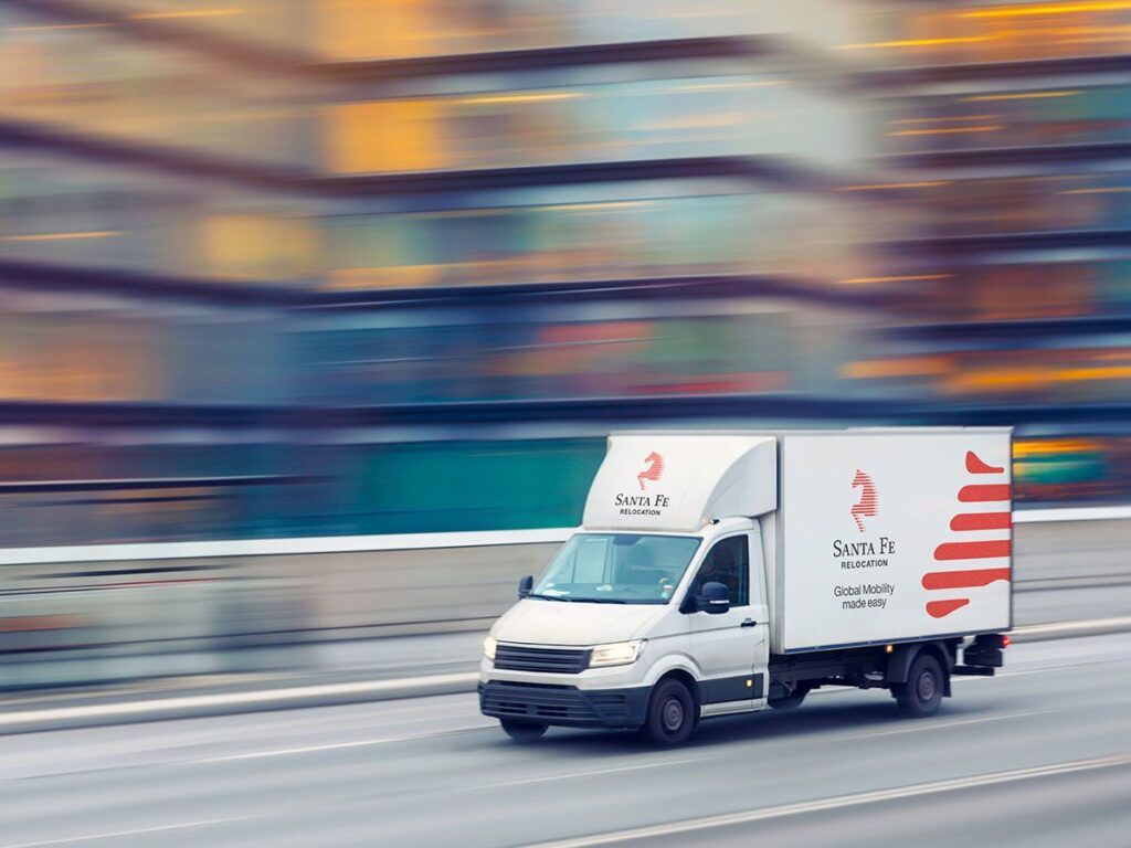 Santa Fe Relocation van delivering a customers belongings overseas via road
